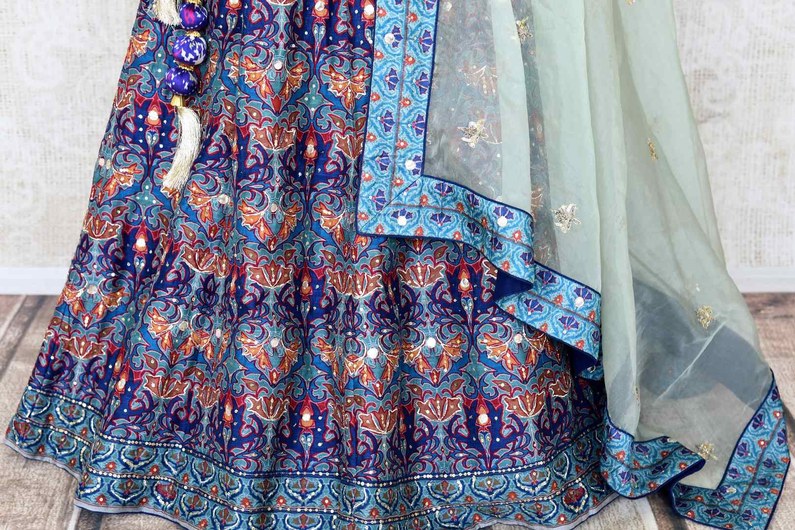 Shop blue printed silk lehenga online in USA with hand embroidery. Make fashionable choices with latest Indian designer clothing from Pure Elegance Indian fashion store in USA. Shop Indian salwar suits, designer Anarkali suits and bridal lehengas for Indian brides in USA from our online store.-bottom