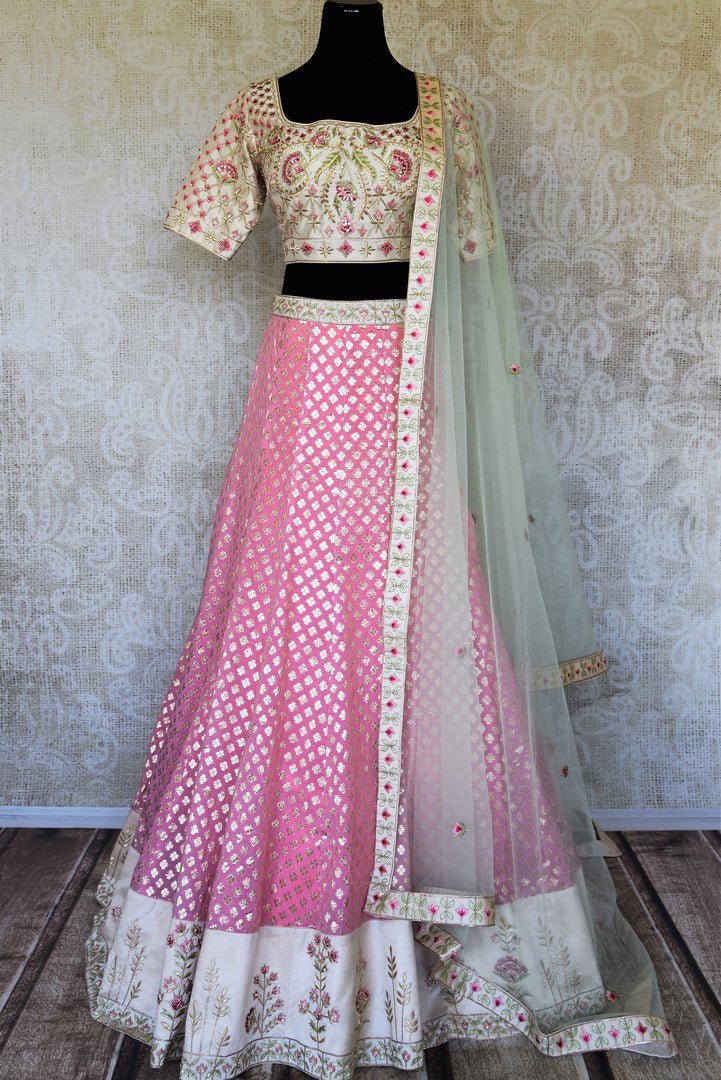 Buy pink and cream embroidered chanderi silk lehenga online in USA with dupatta. Raise your ethnic style quotient at special occasions with exquisite Indian clothing from Pure Elegance Indian clothing store in USA. Pick from a tasteful collection of designer lehengas, Anarkali suits, Indian dresses. Shop now.-full view