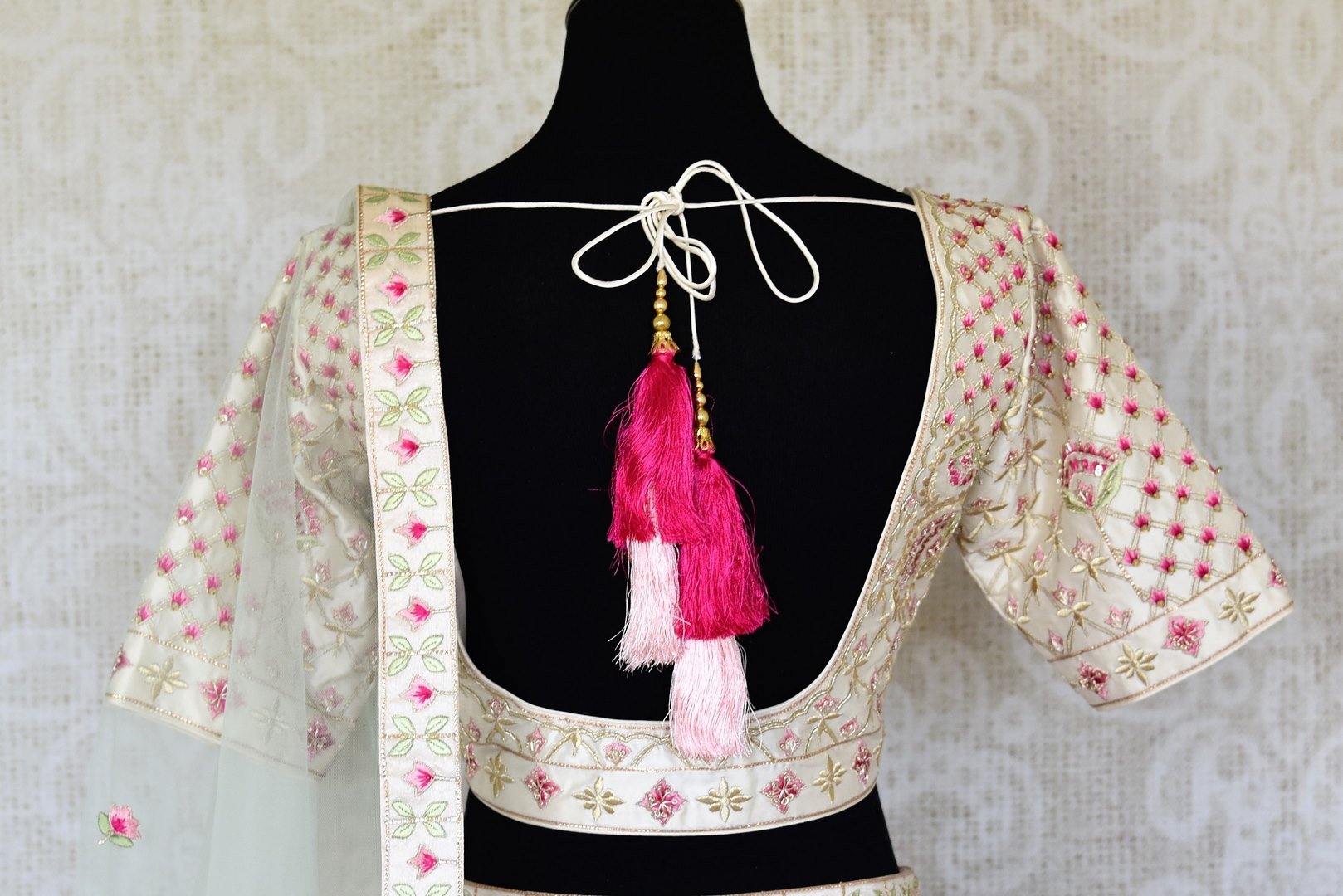 Buy pink and cream embroidered chanderi silk lehenga online in USA with dupatta. Raise your ethnic style quotient at special occasions with exquisite Indian clothing from Pure Elegance Indian clothing store in USA. Pick from a tasteful collection of designer lehengas, Anarkali suits, Indian dresses. Shop now.-back