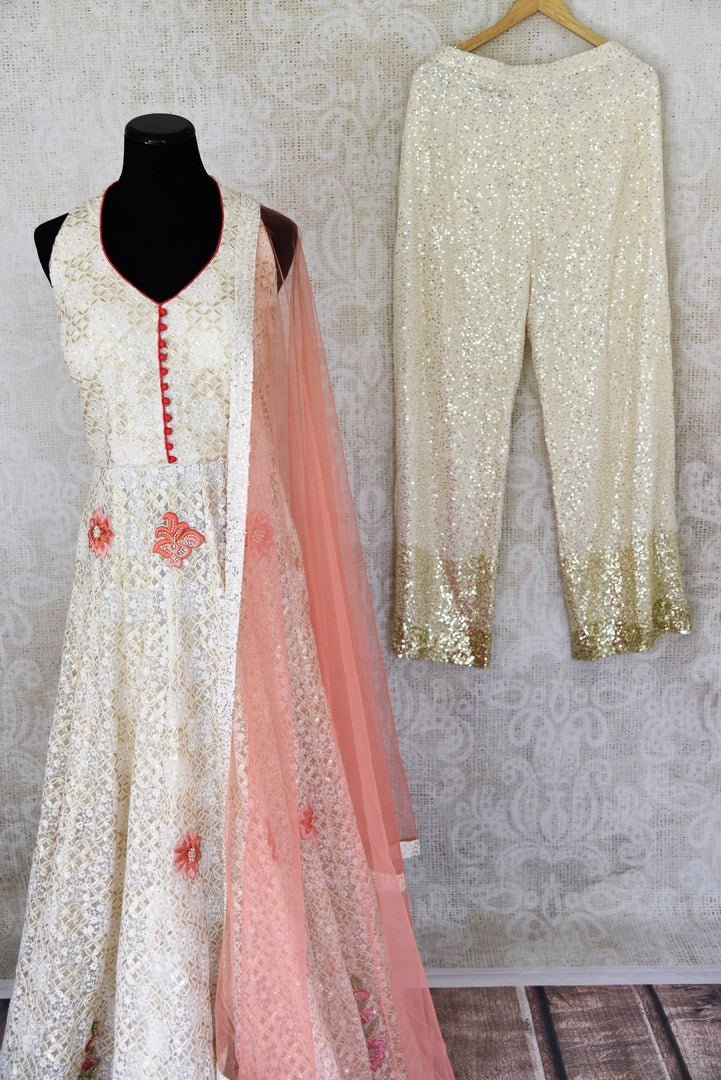 Buy cream embroidered net Anarkali suit online in USA with pants. Step up your ethnic fashion game with exquisite variety of designer Anarkali suits from Pure Elegance Indian clothing store in USA. Shop online.-pants 