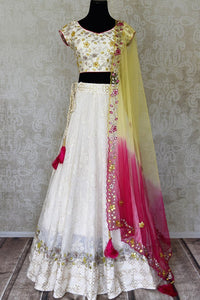 Shop off-white hand embroidered silk lehenga online in USA with dupatta. Step up your ethnic fashion game with exquisite variety of designer lehengas from Pure Elegance Indian clothing store in USA. Shop online.-full view