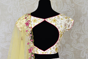 Shop off-white hand embroidered silk lehenga online in USA with dupatta. Step up your ethnic fashion game with exquisite variety of designer lehengas from Pure Elegance Indian clothing store in USA. Shop online.-back