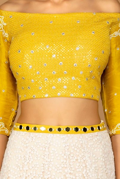 Shop beautiful yellow and white designer lehenga online in USA with dupatta. Gear up for the festive season with exquisite designer lehengas, Anarkali suits. Indian dresses from Pure Elegance Indian fashion store in USA. Shop online now.-closeup
