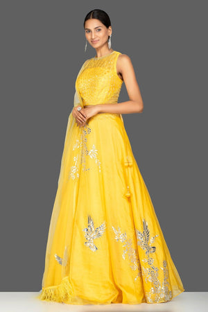 Shop lovely yellow applique work designer lehenga online in USA with dupatta. Gear up for the festive season with exquisite designer lehengas, Anarkali suits. Indian dresses from Pure Elegance Indian fashion store in USA. Shop online now.-side