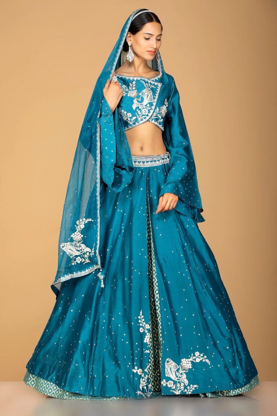 Buy exquisite blue embroidered designer lehenga online in USA with dupatta. Gear up for the festive season with exquisite designer lehengas, Anarkali suits. Indian dresses from Pure Elegance Indian fashion store in USA. Shop online now.-full view