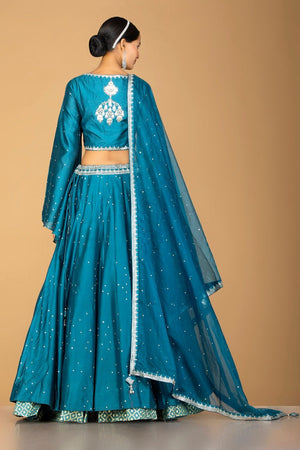 Buy exquisite blue embroidered designer lehenga online in USA with dupatta. Gear up for the festive season with exquisite designer lehengas, Anarkali suits. Indian dresses from Pure Elegance Indian fashion store in USA. Shop online now.-back