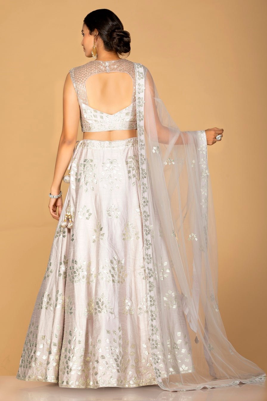 Shop grey silver applique work chanderi silk lehenga online in USA with dupatta. Gear up for the festive season with exquisite designer lehengas, Anarkali suits. Indian dresses from Pure Elegance Indian fashion store in USA. Shop online now.-back