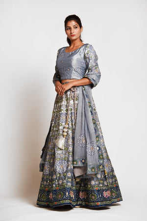 Shop stunning grey printed embroidered silk lehenga online in USA with dupatta. Elevate your traditional Indian style with exquisite designer lehengas, Anarkali suits, traditional salwar suits from Pure Elegance Indian clothing store in USA.-left side