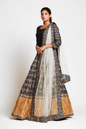 Buy beautiful black embroidered silk lehenga online in USA with mustard border and white net dupatta. Elevate your traditional Indian style with exquisite designer lehengas, Anarkali suits, traditional salwar suits from Pure Elegance Indian clothing store in USA.-side