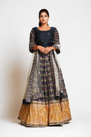 Buy beautiful black embroidered silk lehenga online in USA with mustard border and white net dupatta. Elevate your traditional Indian style with exquisite designer lehengas, Anarkali suits, traditional salwar suits from Pure Elegance Indian clothing store in USA.-front