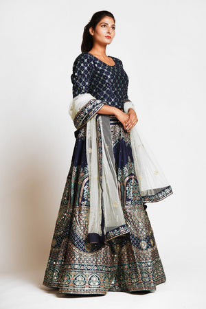 Buy navy blue embroidered designer silk lehenga online in USA with white net dupatta. Elevate your traditional Indian style with exquisite designer lehengas, Anarkali suits, traditional salwar suits from Pure Elegance Indian clothing store in USA.-right side