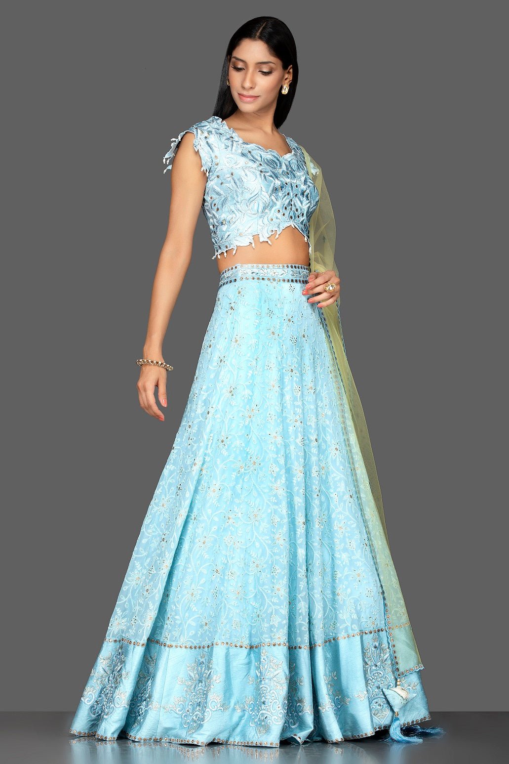 Shop sky blue stone and Lucknowi work georgette lehenga online in USA with green net dupatta. Spread ethnic elegance on weddings and special occasions in splendid designer lehengas, Indowestern dresses crafted with exquisite Indian craftsmanship from Pure Elegance Indian fashion store in USA.-full view