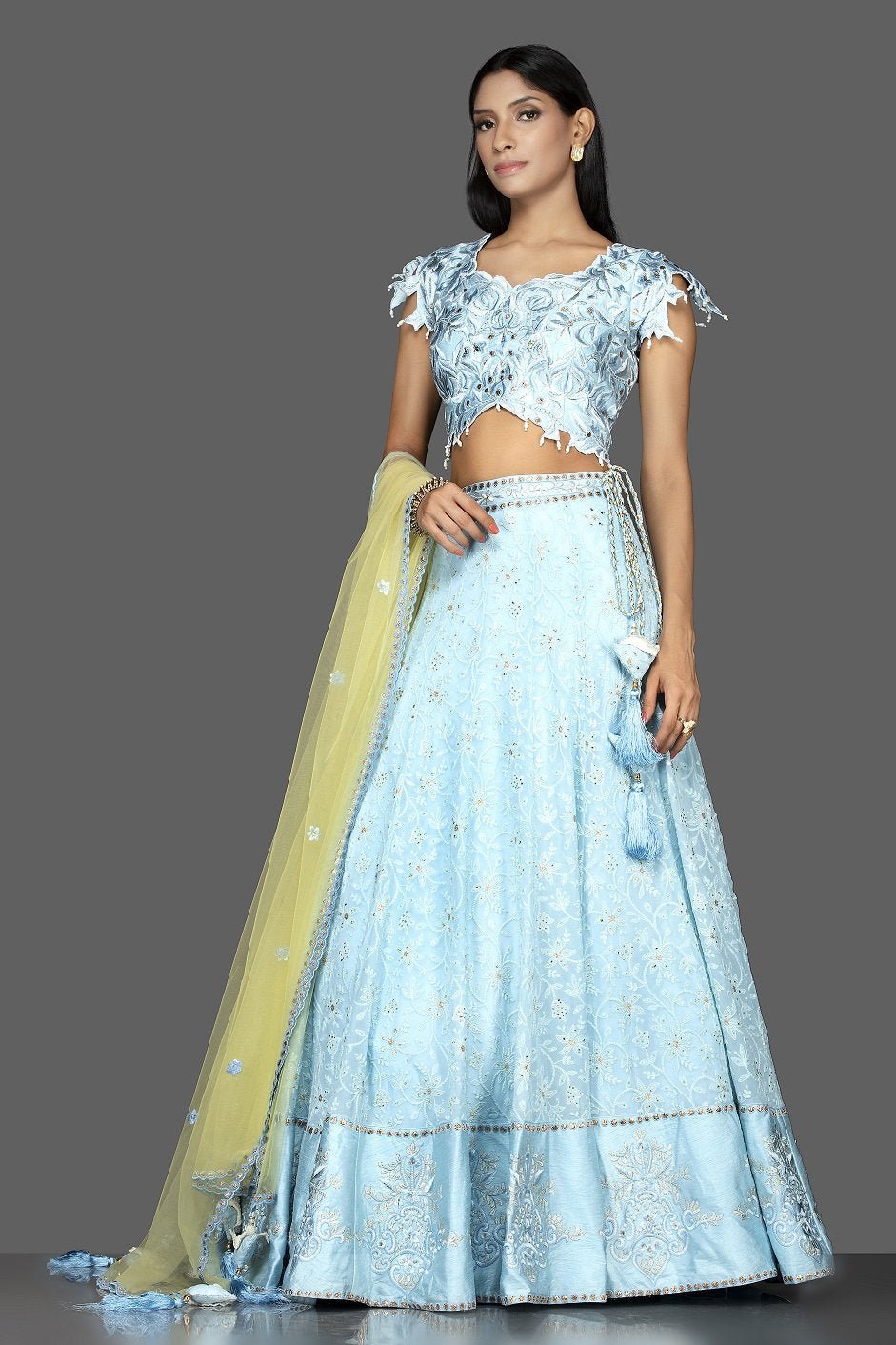Shop sky blue stone and Lucknowi work georgette lehenga online in USA with green net dupatta. Spread ethnic elegance on weddings and special occasions in splendid designer lehengas, Indowestern dresses crafted with exquisite Indian craftsmanship from Pure Elegance Indian fashion store in USA.-side