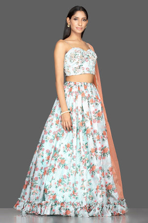 Buy mint green embroidered organza floral lehenga online in USA with peach dupatta. Spread ethnic elegance on weddings and special occasions in splendid designer lehengas, Indowestern dresses crafted with exquisite Indian craftsmanship from Pure Elegance Indian fashion store in USA.-full view