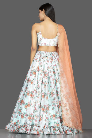 Buy mint green embroidered organza floral lehenga online in USA with peach dupatta. Spread ethnic elegance on weddings and special occasions in splendid designer lehengas, Indowestern dresses crafted with exquisite Indian craftsmanship from Pure Elegance Indian fashion store in USA.-back