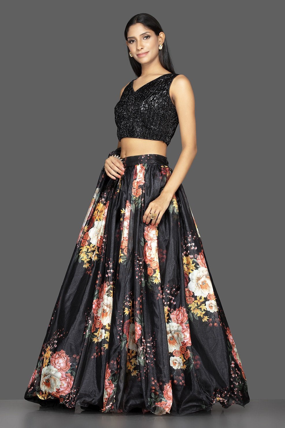 Shop ravishing black embroidered organza floral print lehenga online in USA with matching dupatta. Spread ethnic elegance on weddings and special occasions in splendid designer lehengas, Indowestern dresses crafted with exquisite Indian craftsmanship from Pure Elegance Indian fashion store in USA.-side