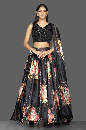 Shop ravishing black embroidered organza floral print lehenga online in USA with matching dupatta. Spread ethnic elegance on weddings and special occasions in splendid designer lehengas, Indowestern dresses crafted with exquisite Indian craftsmanship from Pure Elegance Indian fashion store in USA.-front