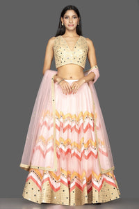 Buy glamorous powder pink chevron design mirror work lehenga online in USA with matching dupatta. Spread ethnic elegance on weddings and special occasions in splendid designer lehengas, Indowestern dresses crafted with exquisite Indian craftsmanship from Pure Elegance Indian fashion store in USA.-full view