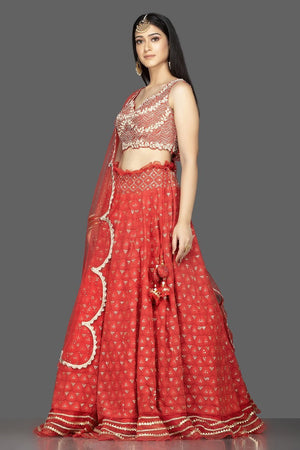 Buy gorgeous red Lucknowi work georgette lehenga online in USA with net dupatta. Look radiant on weddings and special occasions in splendid designer lehengas crafted with finest embroideries and stunning silhouettes from Pure Elegance Indian fashion boutique in USA.-side