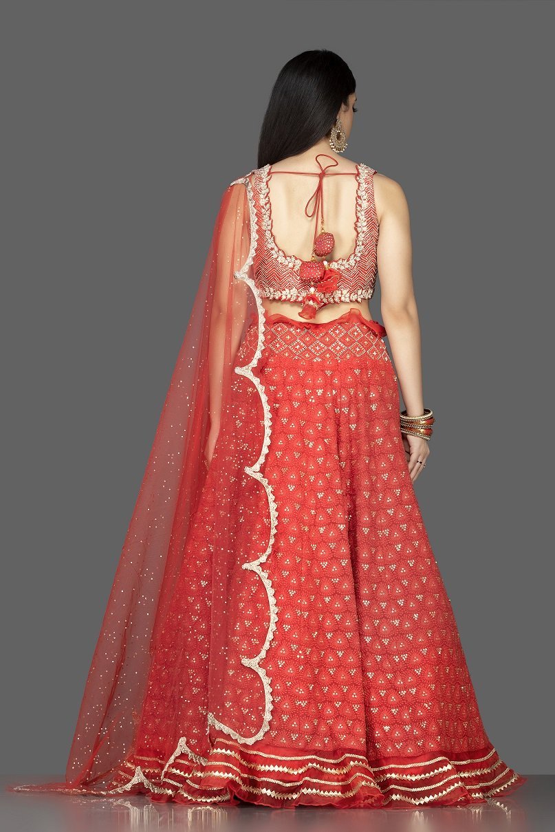 Buy gorgeous red Lucknowi work georgette lehenga online in USA with net dupatta. Look radiant on weddings and special occasions in splendid designer lehengas crafted with finest embroideries and stunning silhouettes from Pure Elegance Indian fashion boutique in USA.-back