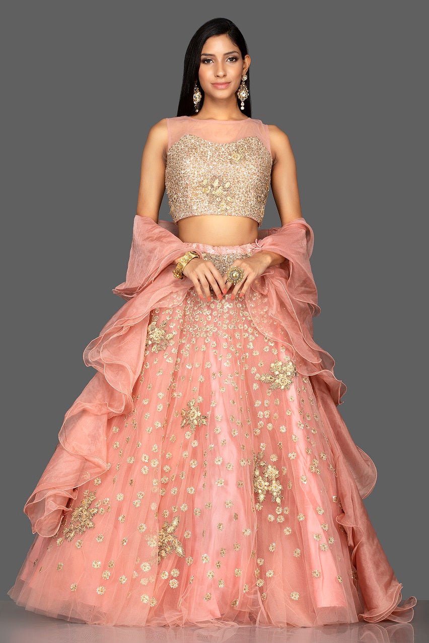 Shop exquisite dusty pink zardozi embroidery net lehenga online in USA with net dupatta. Look radiant on weddings and special occasions in splendid designer lehengas crafted with finest embroideries and stunning silhouettes from Pure Elegance Indian fashion boutique in USA.-full view
