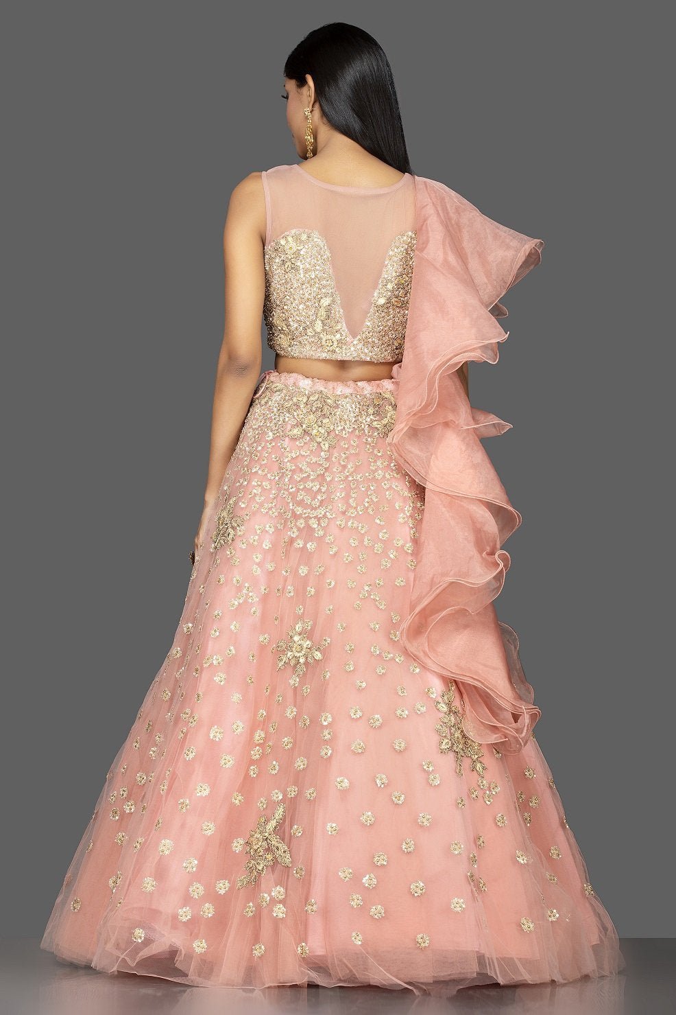 Shop exquisite dusty pink zardozi embroidery net lehenga online in USA with net dupatta. Look radiant on weddings and special occasions in splendid designer lehengas crafted with finest embroideries and stunning silhouettes from Pure Elegance Indian fashion boutique in USA..-back
