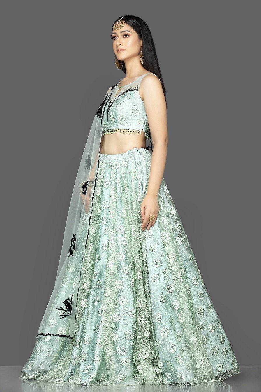 Shop beautiful mint green stone and embroidery net lehenga online in USA with net dupatta. Look radiant on weddings and special occasions in splendid designer lehengas crafted with finest embroideries and stunning silhouettes from Pure Elegance Indian fashion boutique in USA.-back