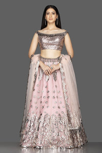 Shop powder pink applique work net lehenga online in USA with net dupatta. Look radiant on weddings and special occasions in splendid designer lehengas crafted with finest embroideries and stunning silhouettes from Pure Elegance Indian fashion boutique in USA.-full view