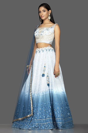 Shop charming ombre blue Lucknowi work georgette lehenga online in USA with matching net dupatta. Look radiant on weddings and special occasions in splendid designer lehengas crafted with finest embroideries and stunning silhouettes from Pure Elegance Indian fashion boutique in USA.-side