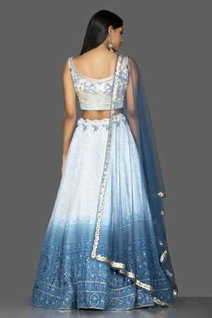 Shop charming ombre blue Lucknowi work georgette lehenga online in USA with matching net dupatta. Look radiant on weddings and special occasions in splendid designer lehengas crafted with finest embroideries and stunning silhouettes from Pure Elegance Indian fashion boutique in USA.-back