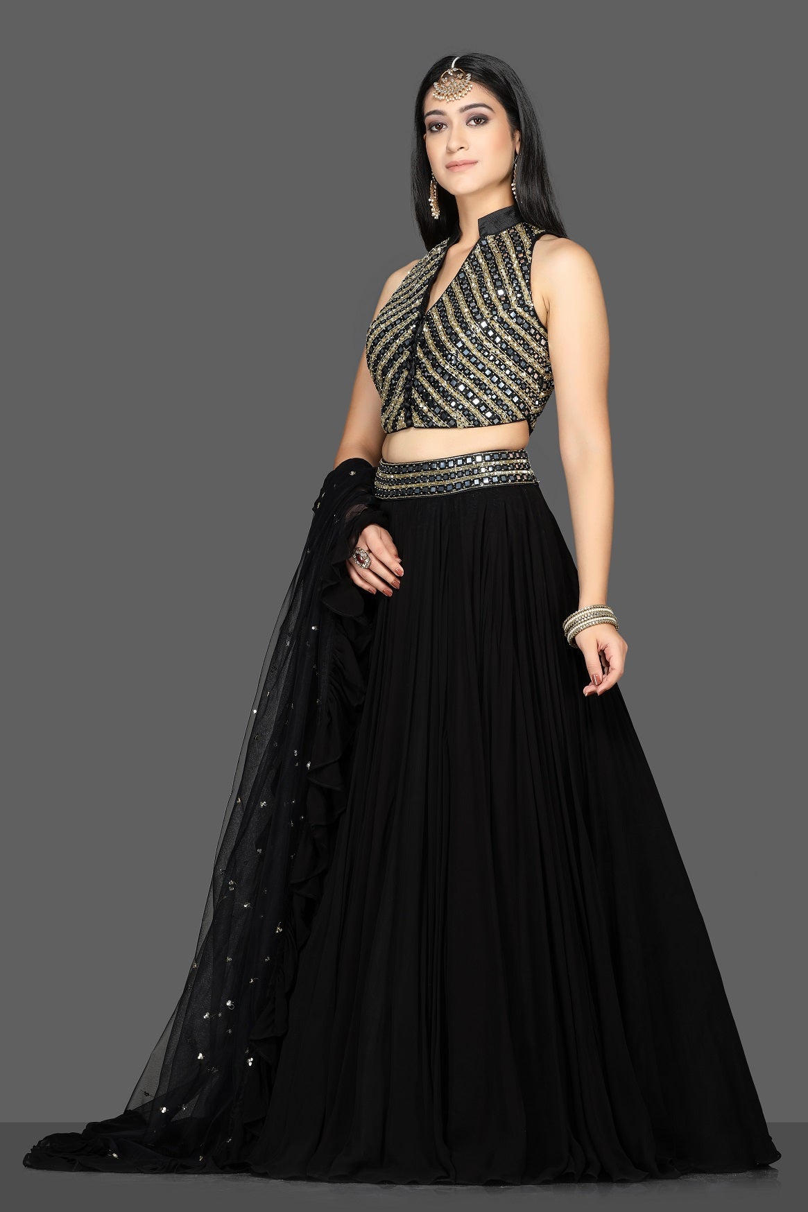 Shop beautiful black embroidered net lehenga online in USA with dupatta. Flaunt ethnic fashion with exquisite designer lehenga, Indian wedding dresses from Pure Elegance Indian fashion boutique in USA.-side