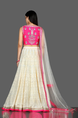 Buy beautiful white and pink Lucknowi embroidery lehenga online in USA with dupatta. Flaunt ethnic fashion with exquisite designer lehenga, Indian wedding dresses from Pure Elegance Indian fashion boutique in USA.-back
