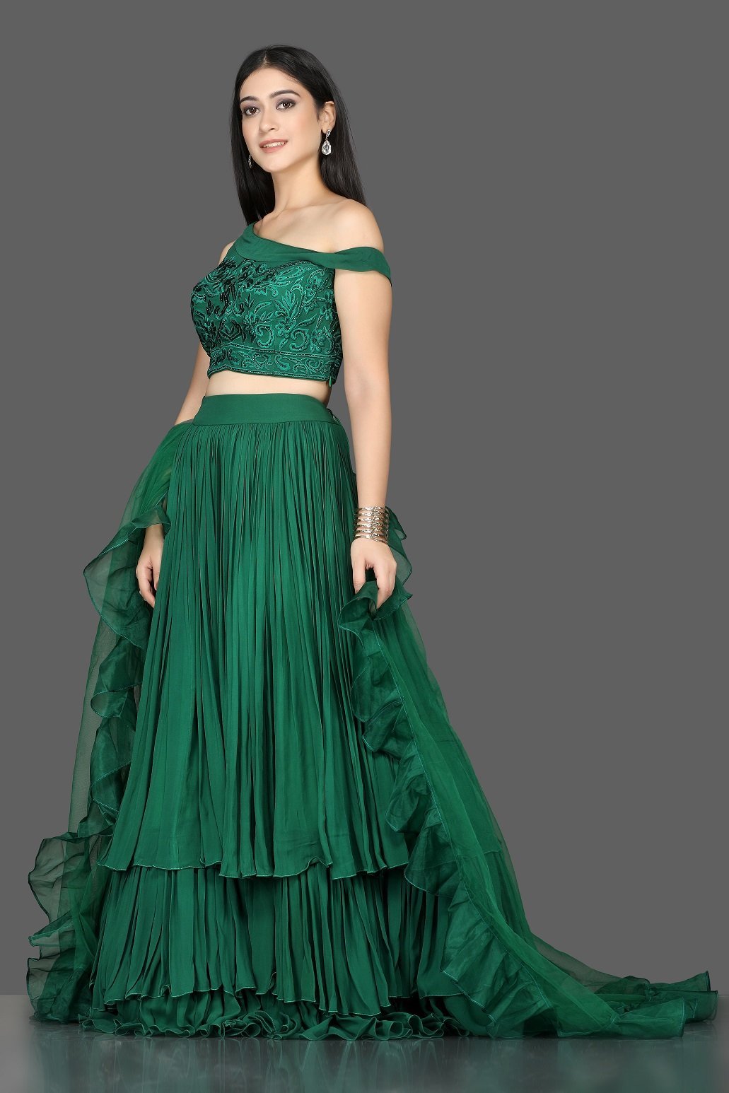 Buy stylish bottle green georgette layered lehenga online in USA with ruffle dupatta. Flaunt ethnic fashion with exquisite designer lehenga, Indian wedding dresses from Pure Elegance Indian fashion boutique in USA.-side