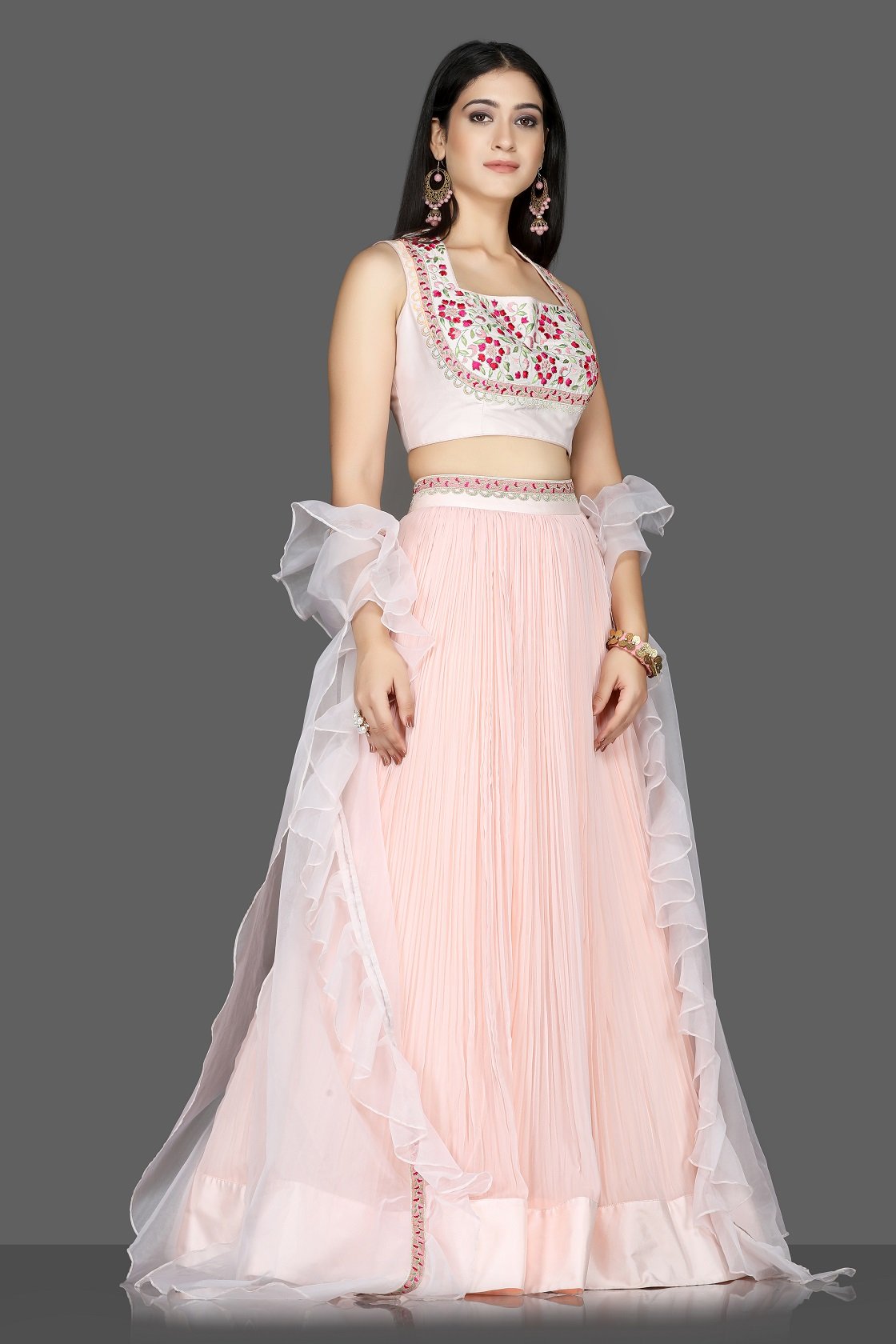 Buy lovely powder pink embroidered georgette lehenga online in USA with organza cape. Flaunt ethnic fashion with exquisite designer lehenga, Indian wedding dresses from Pure Elegance Indian fashion boutique in USA.-side