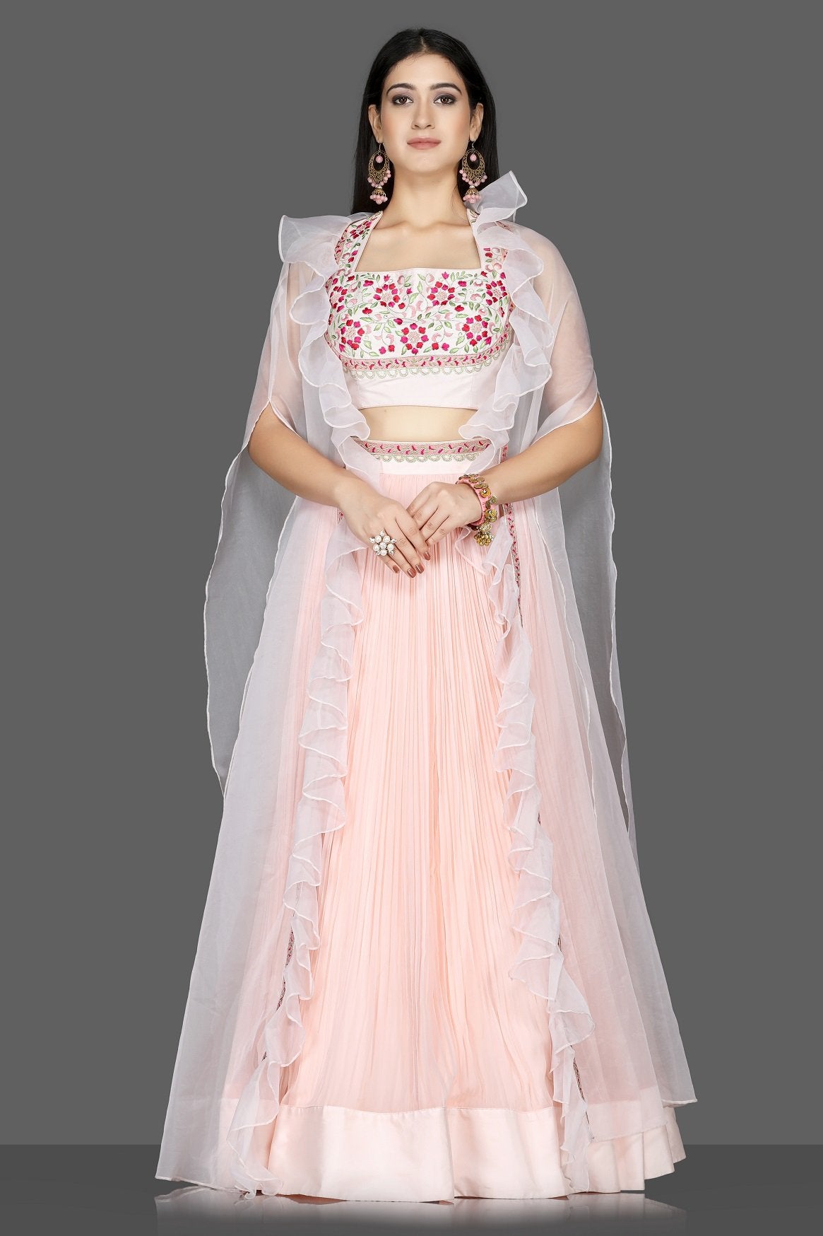 Buy lovely powder pink embroidered georgette lehenga online in USA with organza cape. Flaunt ethnic fashion with exquisite designer lehenga, Indian wedding dresses from Pure Elegance Indian fashion boutique in USA.-full view