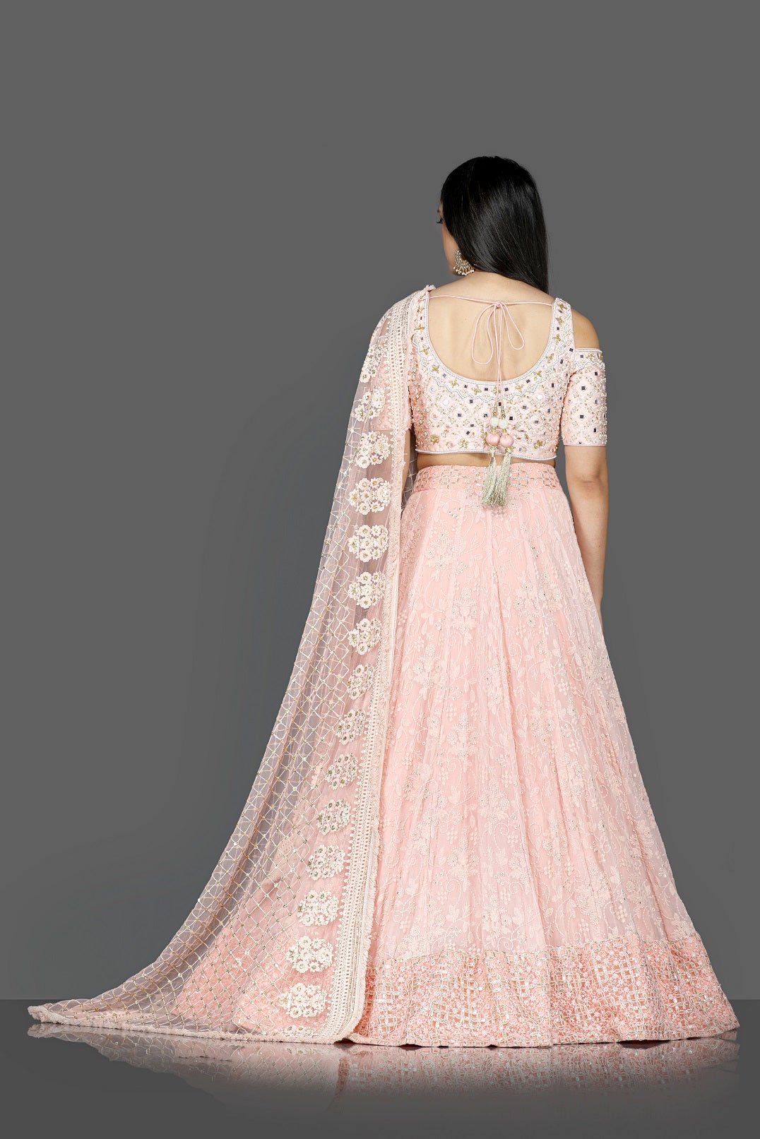 Buy gorgeous powder pink embroidered georgette lehenga online in USA with dupatta. Go for an attractive wedding style with Pure Elegance designer lehengas. traditional salwar suits, Indowestern dresses available at our exclusive Indian fashion store in USA.-back