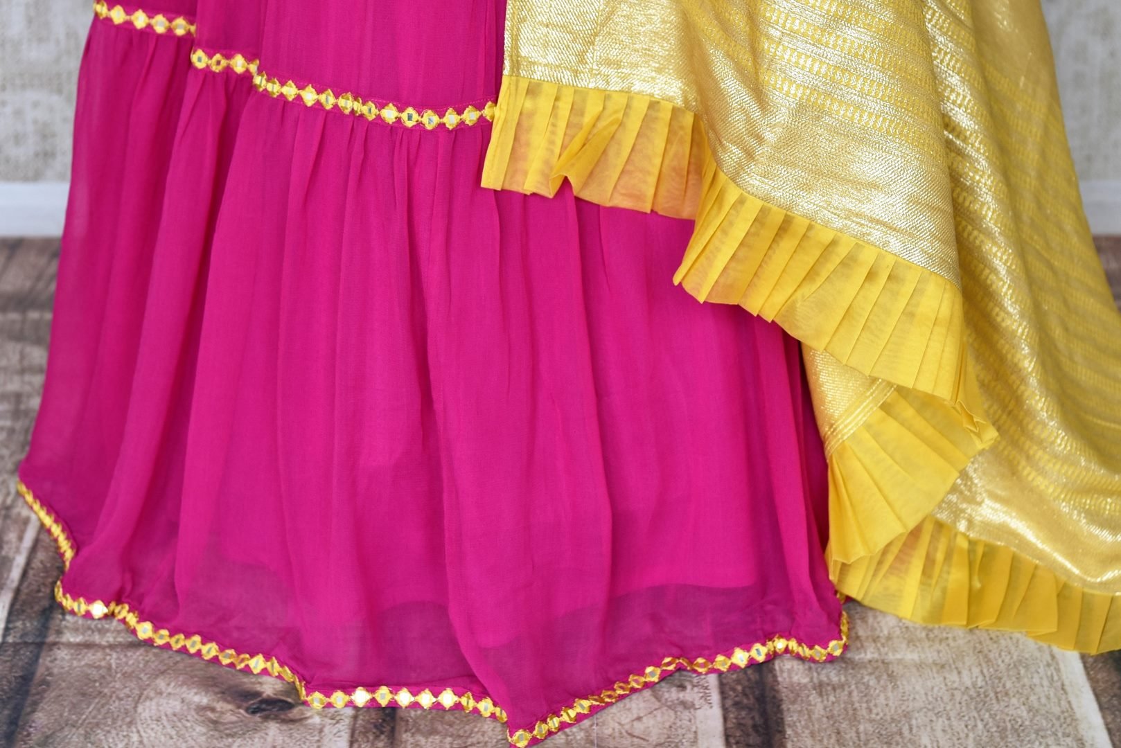 Buy gorgeous pink silk and georgette embroidered lehenga with yellow dupatta online in USA. Be occasion ready in stunning designer dresses, lehengas, palazzo suits, sharara suits, bridal lehengas from Pure Elegance Indian clothing store in USA.-skirt