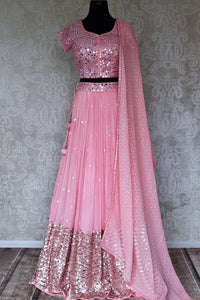 Shop beautiful light pink mirror work net and georgette lehenga online in USA. Be occasion ready in stunning designer dresses, lehengas, palazzo suits, sharara suits, bridal lehengas from Pure Elegance Indian clothing store in USA.-full view