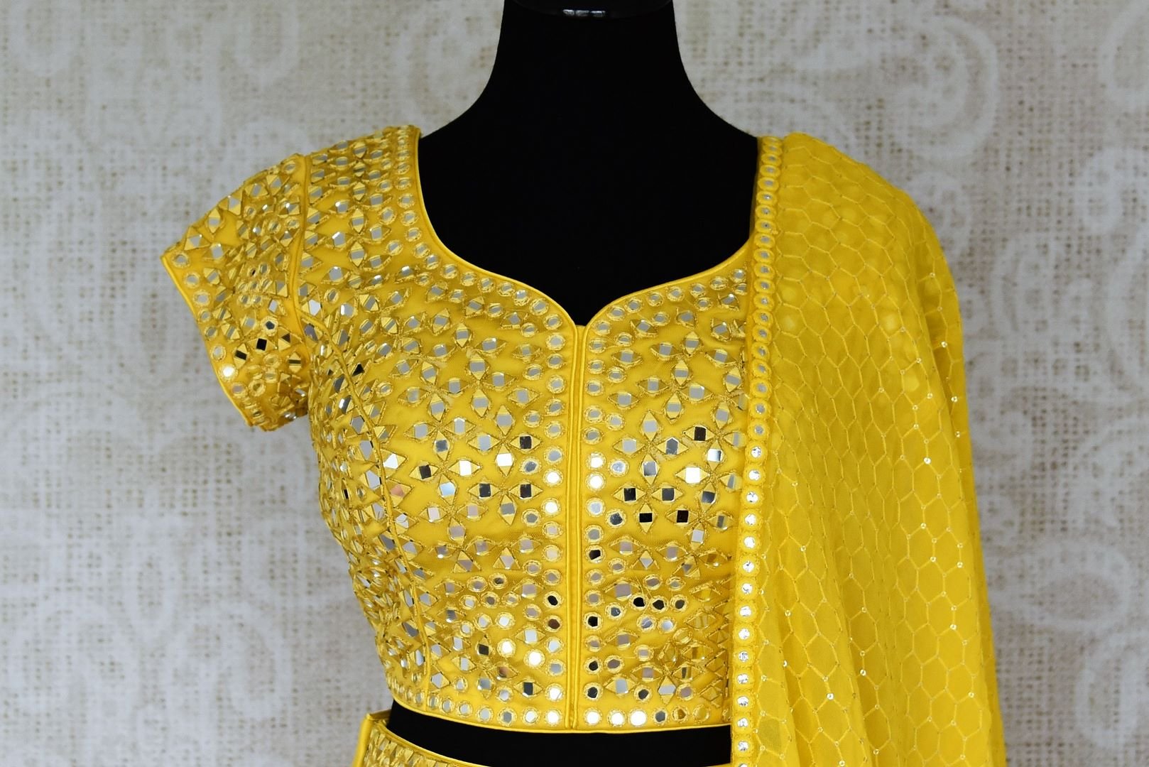 Shop stunning yellow mirror work net and georgette lehenga online in USA. Be occasion ready in stunning designer dresses, lehengas, palazzo suits, sharara suits, bridal lehengas from Pure Elegance Indian clothing store in USA.-blouse 