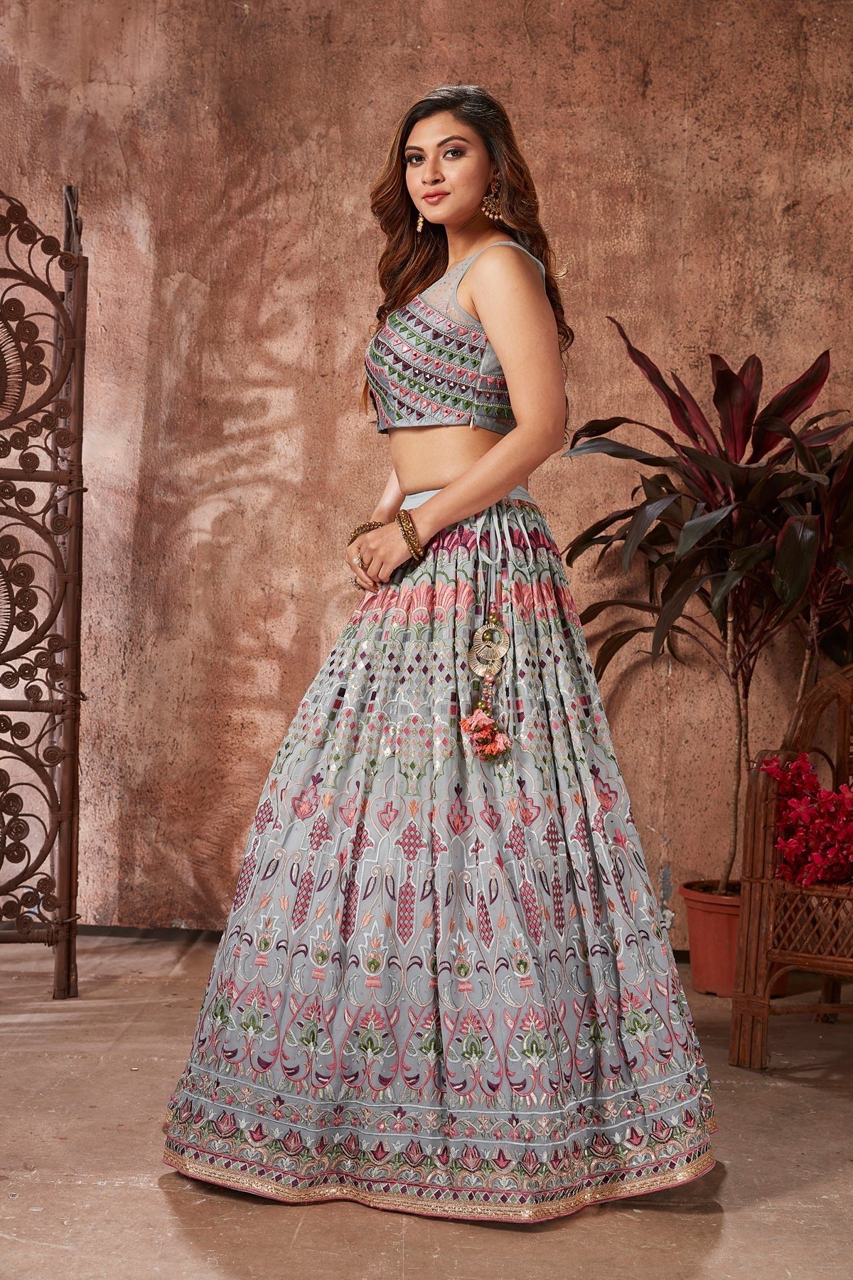 Buy beautiful light grey mirror work georgette lehenga online in USA with dupatta. Dazzle at weddings and parties in exquisite Indian designerwear dresses, designer lehengas, Anarkali suits, gowns, palazzo suits, sharara suits from Pure Elegance Indian fashion store in USA.-left