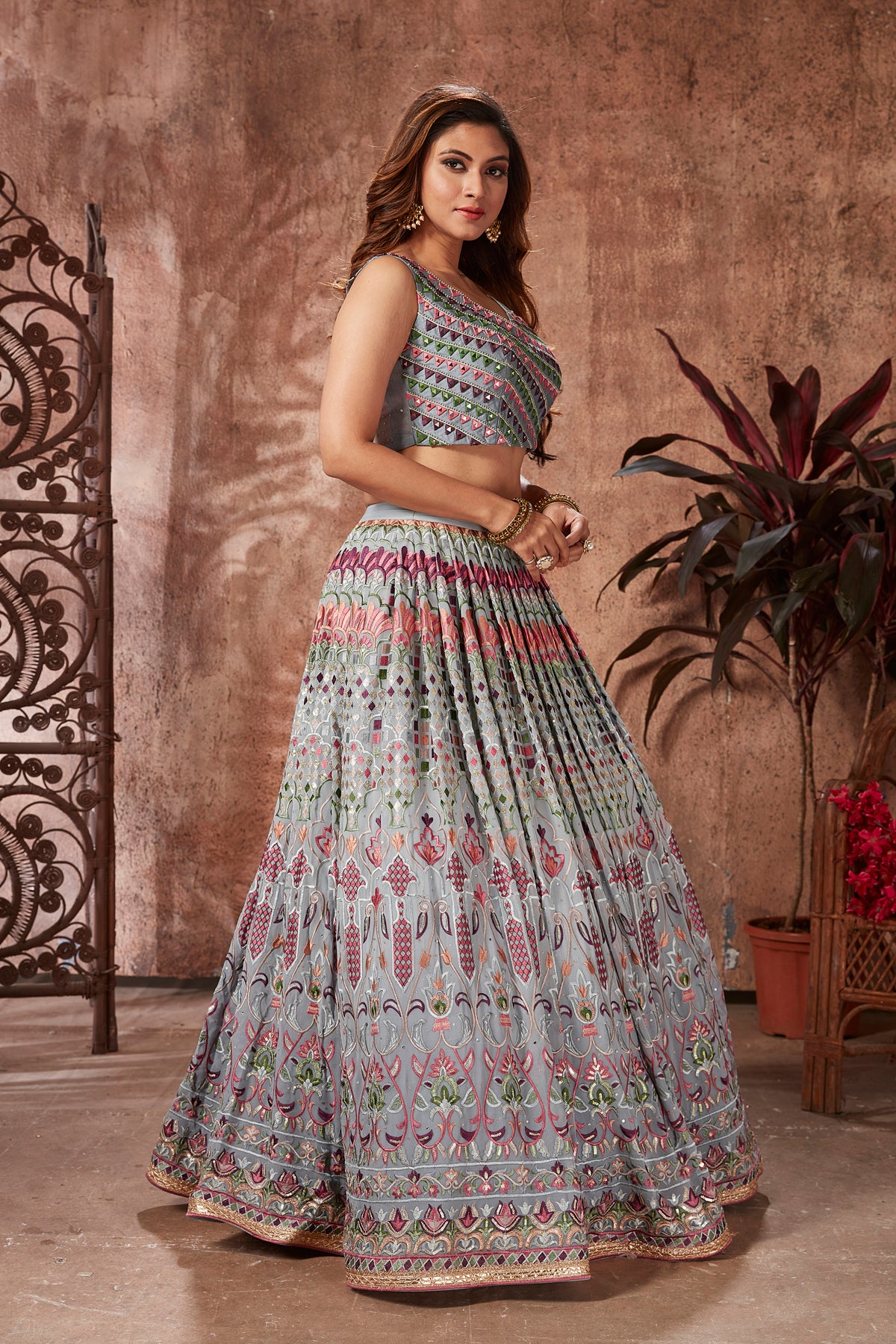 Buy beautiful light grey mirror work georgette lehenga online in USA with dupatta. Dazzle at weddings and parties in exquisite Indian designerwear dresses, designer lehengas, Anarkali suits, gowns, palazzo suits, sharara suits from Pure Elegance Indian fashion store in USA.-right