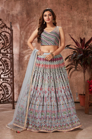 Buy beautiful light grey mirror work georgette lehenga online in USA with dupatta. Dazzle at weddings and parties in exquisite Indian designerwear dresses, designer lehengas, Anarkali suits, gowns, palazzo suits, sharara suits from Pure Elegance Indian fashion store in USA.-front