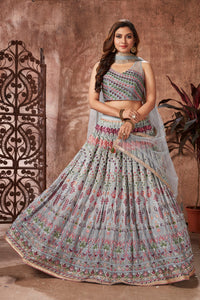 Buy beautiful light grey mirror work georgette lehenga online in USA with dupatta. Dazzle at weddings and parties in exquisite Indian designerwear dresses, designer lehengas, Anarkali suits, gowns, palazzo suits, sharara suits from Pure Elegance Indian fashion store in USA.-full view
