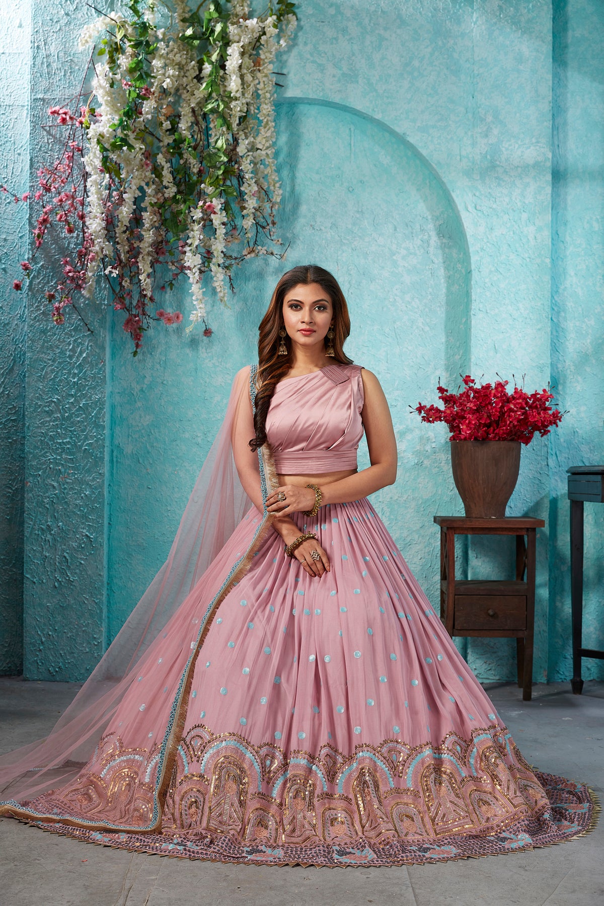 Buy stunning onion pink embroidered georgette lehenga online in USA with dupatta. Dazzle at weddings and parties in exquisite Indian designerwear dresses, designer lehengas, Anarkali suits, gowns, palazzo suits, sharara suits from Pure Elegance Indian fashion store in USA.-front