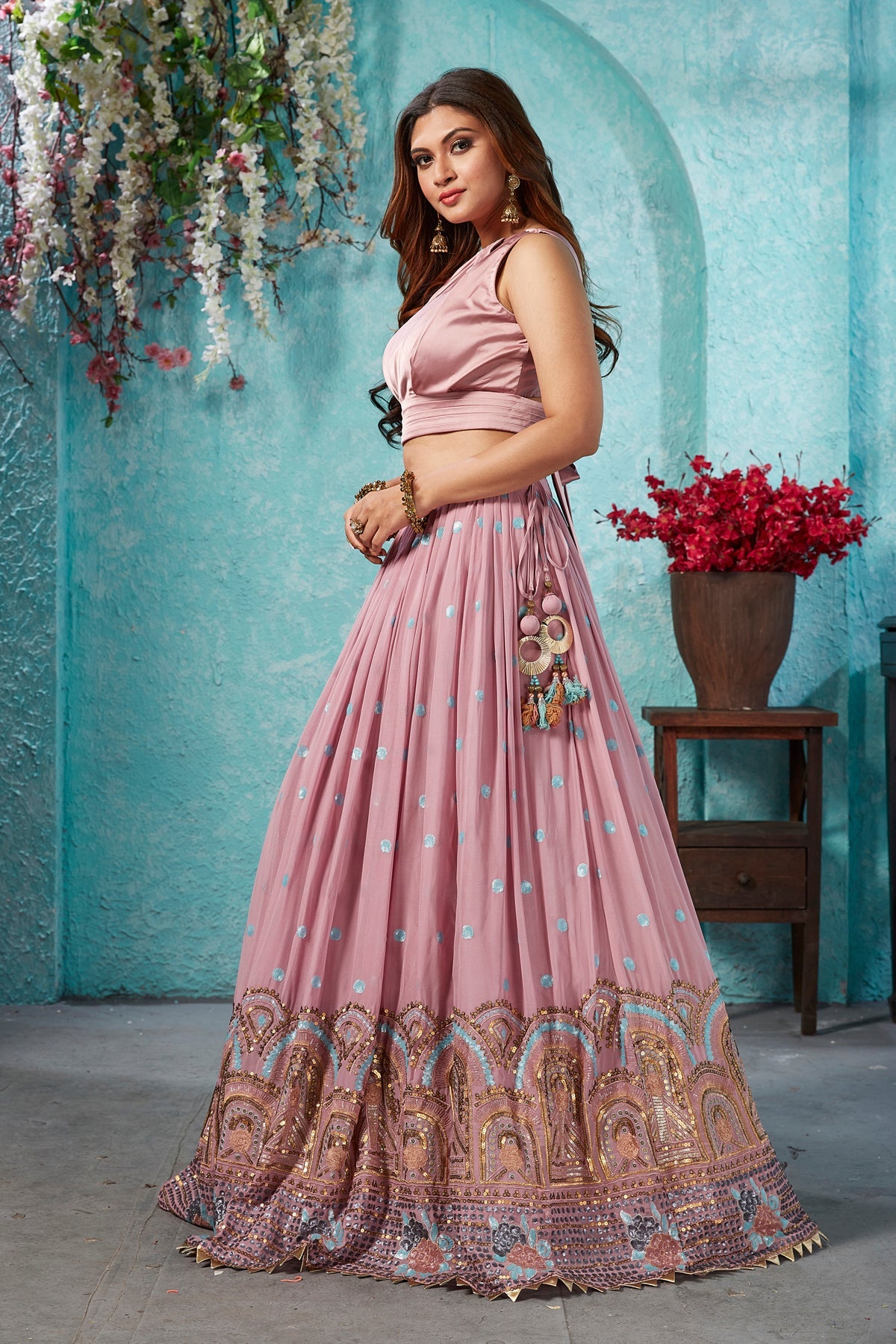 Buy stunning onion pink embroidered georgette lehenga online in USA with dupatta. Dazzle at weddings and parties in exquisite Indian designerwear dresses, designer lehengas, Anarkali suits, gowns, palazzo suits, sharara suits from Pure Elegance Indian fashion store in USA.-left