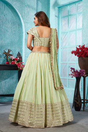 Buy beautiful pista green embroidered georgette lehenga online in USA with dupatta. Dazzle at weddings and parties in exquisite Indian designerwear dresses, designer lehengas, Anarkali suits, gowns, palazzo suits, sharara suits from Pure Elegance Indian fashion store in USA.-back