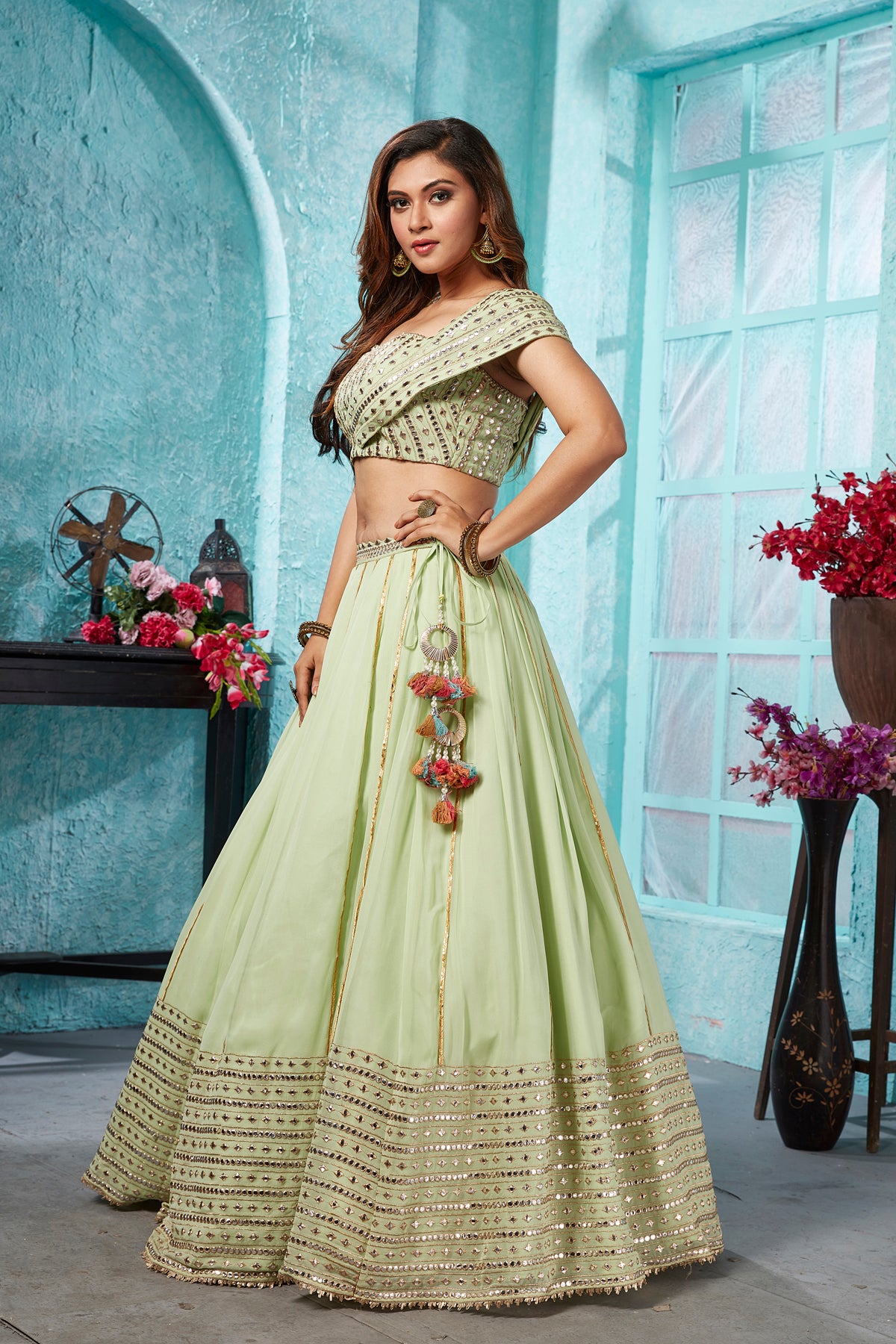 Buy beautiful pista green embroidered georgette lehenga online in USA with dupatta. Dazzle at weddings and parties in exquisite Indian designerwear dresses, designer lehengas, Anarkali suits, gowns, palazzo suits, sharara suits from Pure Elegance Indian fashion store in USA.-right