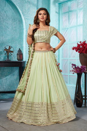 Buy beautiful pista green embroidered georgette lehenga online in USA with dupatta. Dazzle at weddings and parties in exquisite Indian designerwear dresses, designer lehengas, Anarkali suits, gowns, palazzo suits, sharara suits from Pure Elegance Indian fashion store in USA.-front