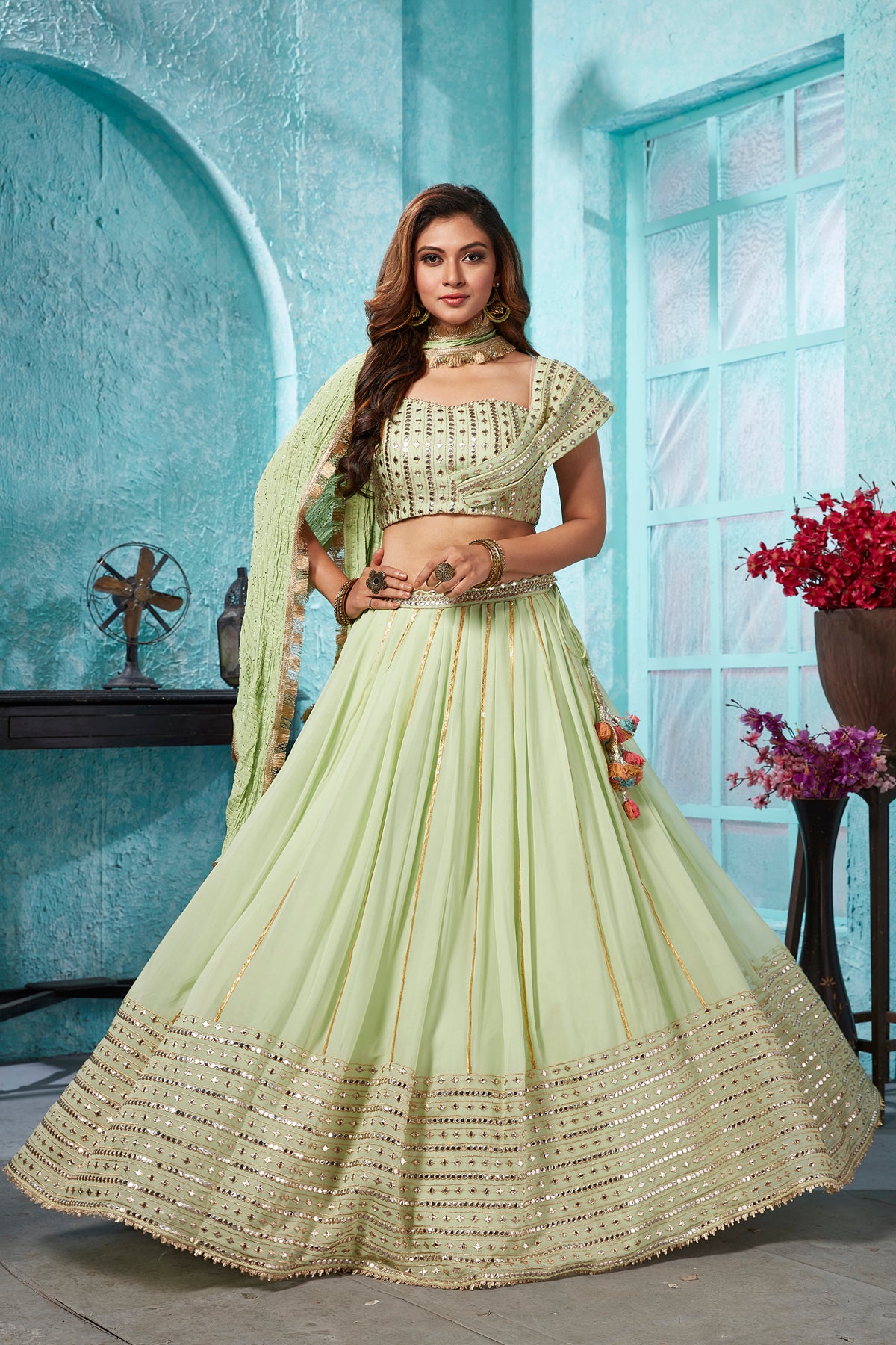 Buy beautiful pista green embroidered georgette lehenga online in USA with dupatta. Dazzle at weddings and parties in exquisite Indian designerwear dresses, designer lehengas, Anarkali suits, gowns, palazzo suits, sharara suits from Pure Elegance Indian fashion store in USA.-full view