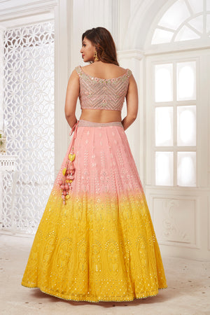 Buy beautiful powder pink and yellow embroidered lehenga online in USA with dupatta. Dazzle at weddings and parties in exquisite Indian designerwear dresses, designer lehengas, Anarkali suits, gowns, palazzo suits, sharara suits from Pure Elegance Indian fashion store in USA.-back